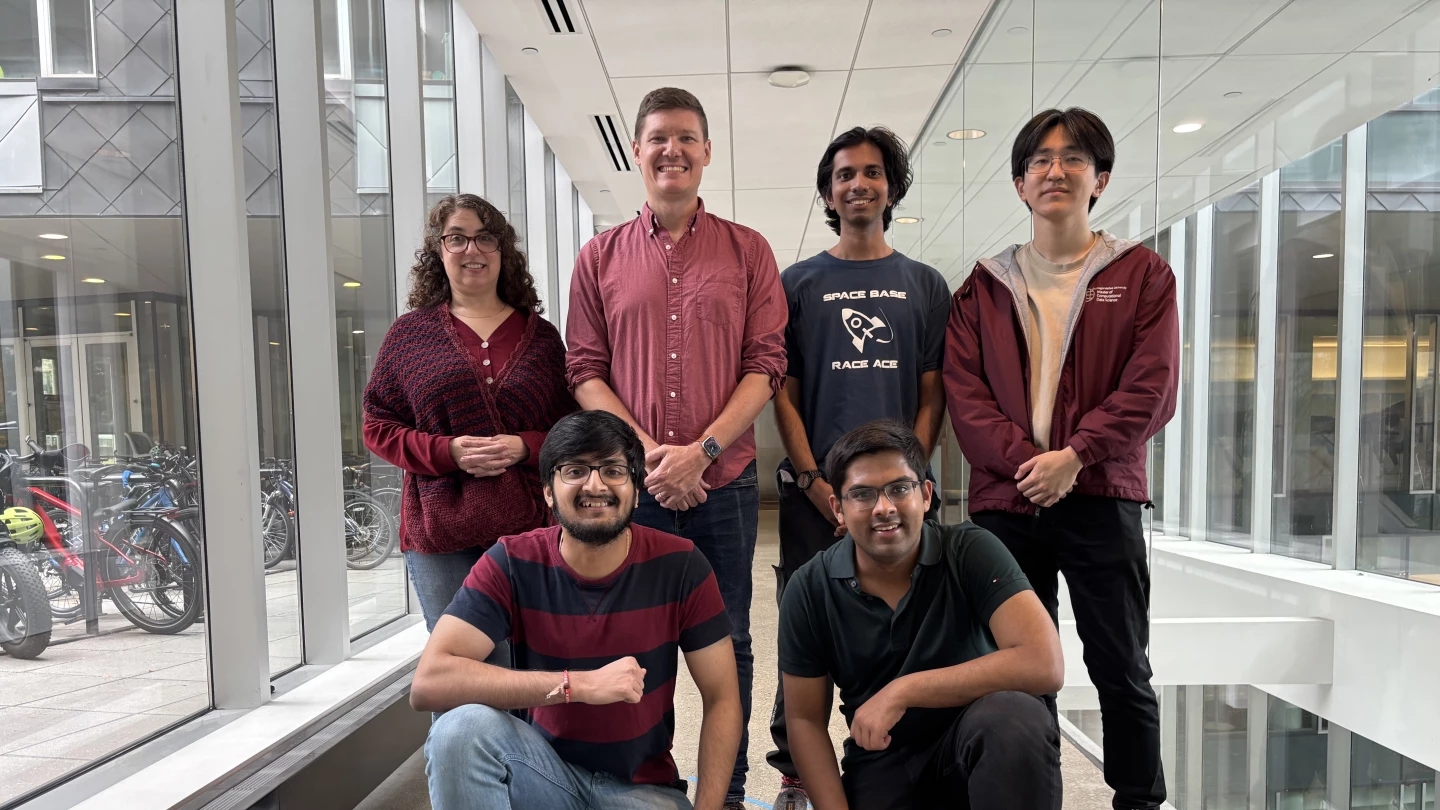 A posed shot of the Purpl3Pwn3rs team. Photo Credit: Amazon